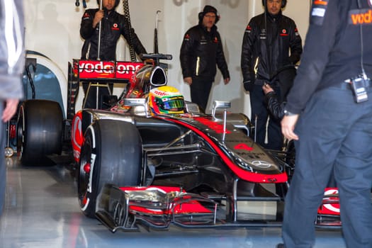 JEREZ DE LA FRONTERA, SPAIN - FEB 10: Lewis Hamilton of McLaren F1 waiting on the pit on training session on February 10 , 2012, in Jerez de la Frontera , Spain