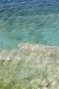 Rock and clear water at shore of Georgian Bay of lake Huron Ontario