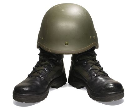 Soldier: military boots and helmet. Isolated on white. Clipping path