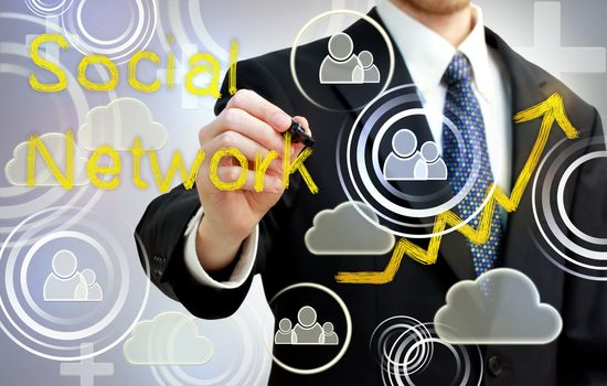 Businessman drawing social network with rising arrows