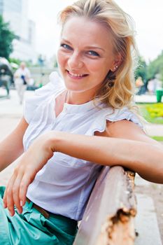 Young and beautiful woman relaxing in the park