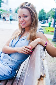 Young and beautiful woman relaxing in the park