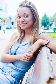 Young and beautiful woman relaxing in the park