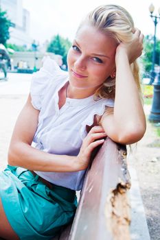 Young and beautiful woman relaxing in the park