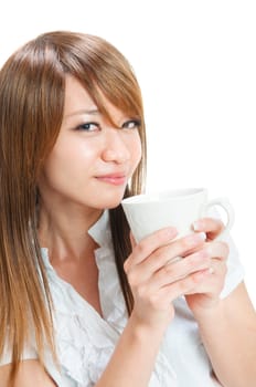 Beautiful young Asian girl holding a cup of tea/coffee over white background
