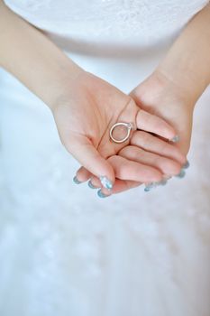 Wedding ring on bride palm