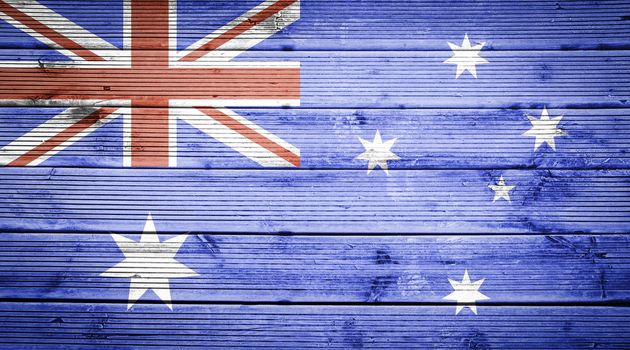 Natural wood planks texture background with the colors of the flag of Australia