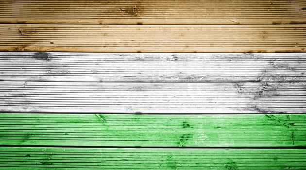 Natural wood planks texture background with the colors of the flag of India