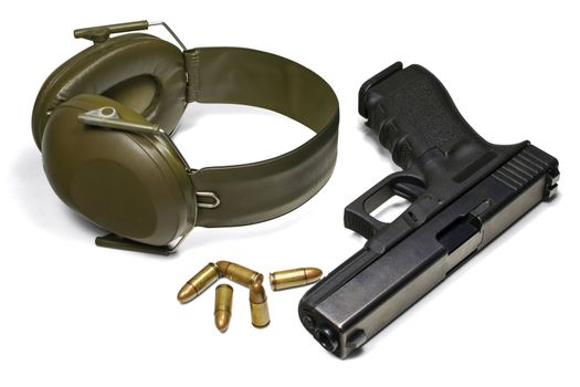 Isolated on white background. 3 separate clipping paths: pistol, earmuffs, ammo and 1 complete for all objects.