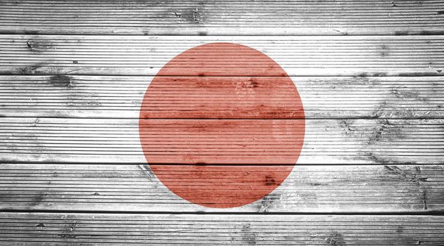 Natural wood planks texture background with the colors of the flag of Japan