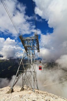 summer view of Primiero valley with cableway pylon on foreground, San Martino di Castrozza, Trentino, Italy
