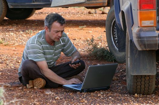 in search of the good road in the Australian bush using a gps connected to a laptop.