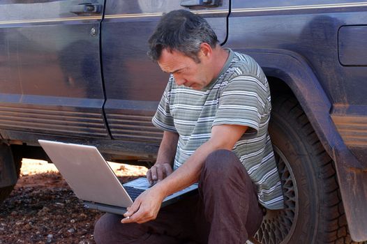 in search of the good road in the Australian bush using a gps connected to a laptop.