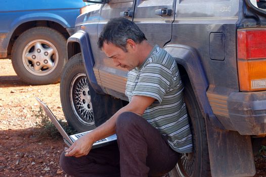 in search of the good road in the Australian bush using a gps connected to a laptop.