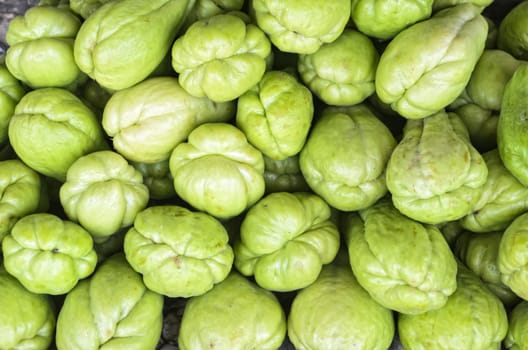 Full frame of bunch of sayote on a countryside vegetable stand