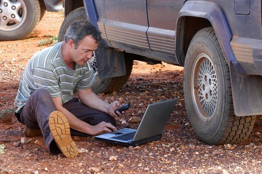 in search of the good road in the Australian bush using a gps connected to a laptop.