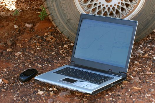 in search of the good road in the Australian bush using a gps connected to a laptop.