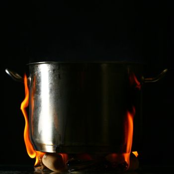 big pan and smoke on black