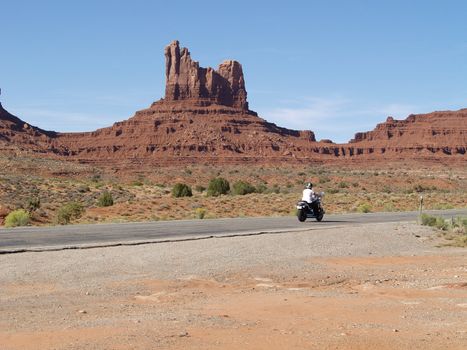 MONUMENT VALLEY, USA - SEPTEMBER 22: Road of Monument Valey on  Sepetmeber 22, 2011. The largest sandstone buttes reaching 1,000 ft (300 m) above the valley floor.