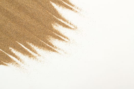 closeup of sand on a white for background or backdrop use