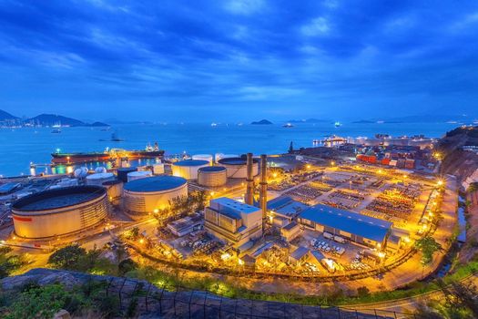 Gas storage spheres tank in petrochemical plant in sunset