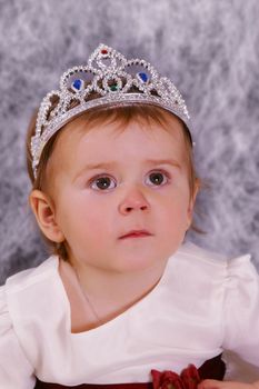 Beautiful girl in white dress and a diadem