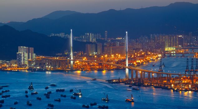 Freeway in night with cars light in modern city 