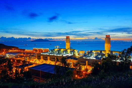 Oil and water refinery at twilight - Petrochemical factory, chinese oil and water words on tank