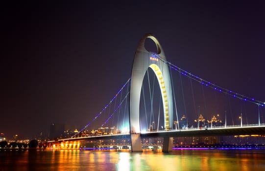 Night scene of Liede bridge with brilliant spot light in Guangzhou city of China 