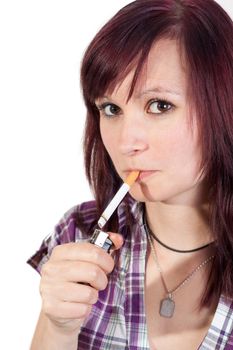 young red haired woman is smoking a cigarette - isolated on white background