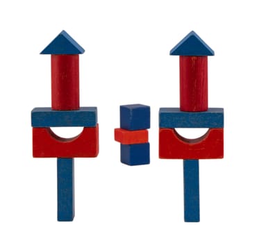 red blue wooden log toy tower constructions stand isolated on white background.