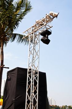 Spotlights mounted on steel poles. The sky in the background.