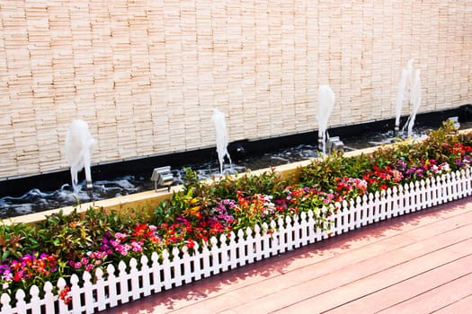 Flower pot garden. The decoration on the side of the building.