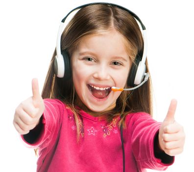 Smiling little girl in headset isolated over white with thumbs up
