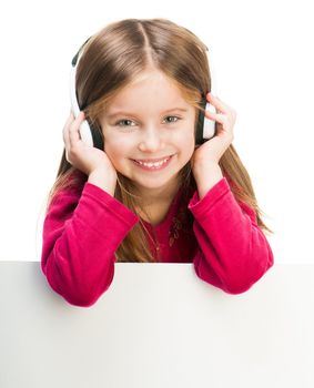 little girl in headphones with white banner
