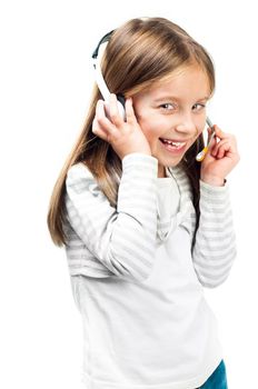 Smiling little girl in headset isolated on a white background