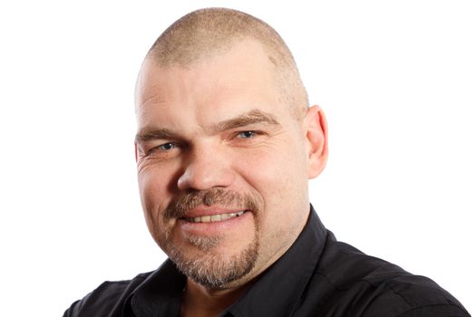 Portrait of smiling man with a stylish beard and short hair on a white background
