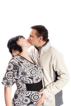 man kissing pregnant woman on white background