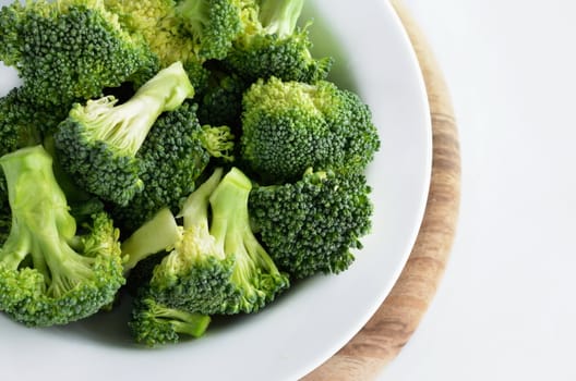 Broccoli vegetable in dish  isolated on white