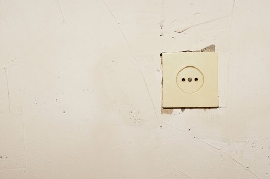 Plastic socket mounted in a concrete wall putty