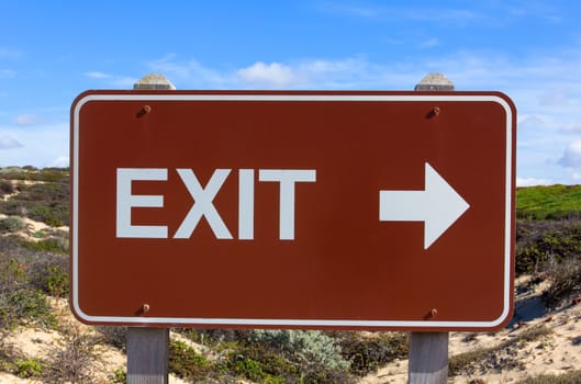 Exit Road Sign With Arrow With Blue Sky Background