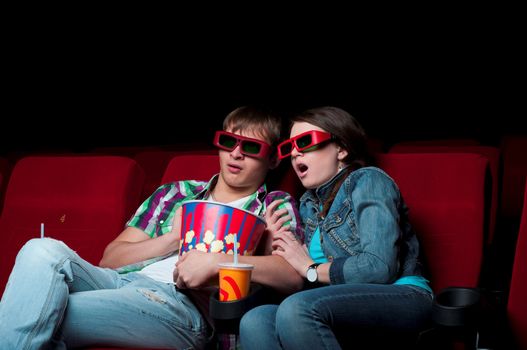 couple in a movie theater, watching a 3D movie