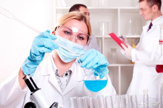 chemist working in the laboratory, mix liquid