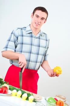 portrait of a man, cut vegetables, make meal