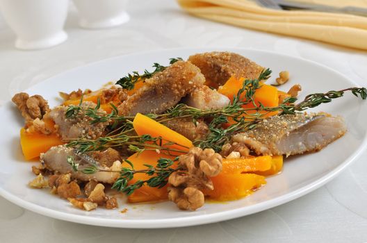 Herring in the pumpkin gratin with nut sauce