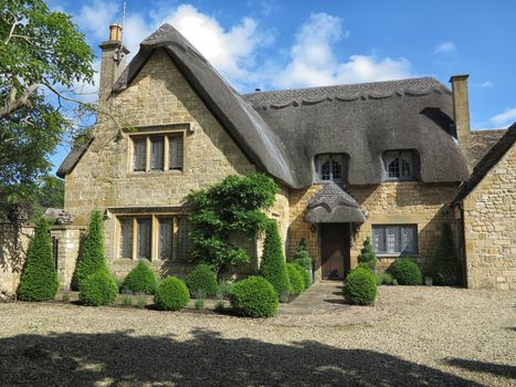 Beautiful old cottage with thatched roof in the village of Chipping Campden, Cotswold, United Kingdom.