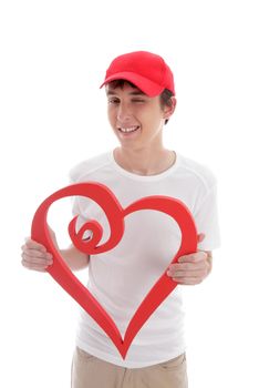 A teenager holding a red love heart and gesturing a cheeky wink.  White background.