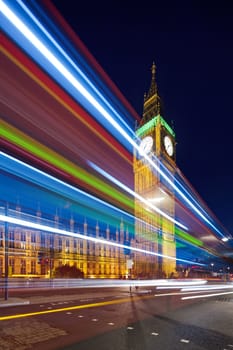 Big Ben in the evening. Dabldekker passes and leaves a line of light at slow shutter speeds. Photo taken tilt-shift lens, vertically stored