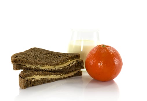 brown bread with chees fruit and glass of milk