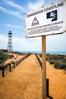 An image of the nice scenery of Broome Australia with warning sign